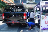 Petugas menguji opasitas gas buang mobil dinas BPBD Kota Yogyakarta jenis Mitsubishi Triton dalam program uji emisi gratis di Kompleks Balai Kota Yogyakarta, Selasa (22/9/2026).