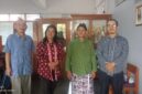 Kepala SMP Taman Dewasa Ibu Pawiyatan Ki Rosidi (second right, berbusana adat lurik hijau) berfoto bersama jajaran guru pendamping di lingkungan sekolah, Yogyakarta